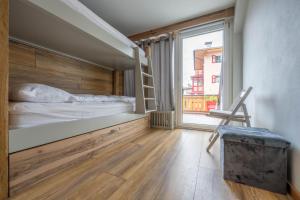 A bed or beds in a room at Cesa te Piaz