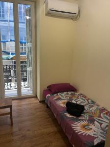 Postel nebo postele na pokoji v ubytování Hôtel Lyonnais
