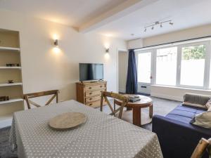 a living room with a table and a couch at West Morton Suite in Thornhill