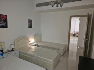 Giường trong phòng chung tại Texico Muscat Down TownHostel