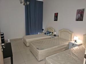 Giường trong phòng chung tại Texico Muscat Down TownHostel