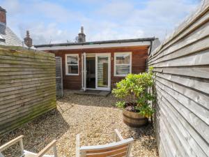 a bedroom house with a garden in front of it at The Suite in Thornhill
