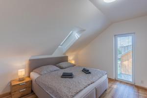 Posteľ alebo postele v izbe v ubytovaní Apartmán Černá v Pošumaví