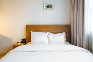 Postel nebo postele na pokoji v ubytování Chuncheon Hey Hotel