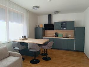 Kuchyň nebo kuchyňský kout v ubytování Apartments Nassfeldpass