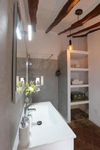 a bathroom with a white tub and a sink at Casalar in Alhama de Granada +69 photos