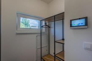 Televízia a/alebo spoločenská miestnosť v ubytovaní Apartmán Černá v Pošumaví