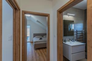 Posteľ alebo postele v izbe v ubytovaní Apartmán Černá v Pošumaví