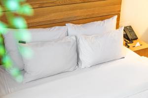 Postel nebo postele na pokoji v ubytování Chuncheon Hey Hotel