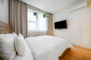 TV a/nebo společenská místnost v ubytování Chuncheon Hey Hotel