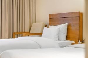 Postel nebo postele na pokoji v ubytování Chuncheon Hey Hotel