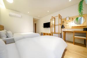 TV a/nebo společenská místnost v ubytování Chuncheon Hey Hotel