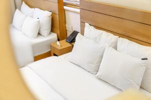 Postel nebo postele na pokoji v ubytování Chuncheon Hey Hotel
