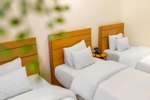 Postel nebo postele na pokoji v ubytování Chuncheon Hey Hotel
