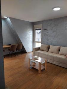 Zona de estar de Apartmani DIVČI TRON 12