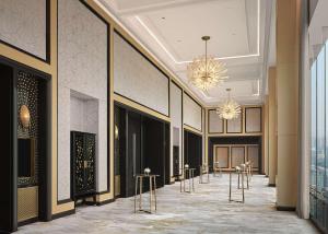 a lobby with a row of stools in a building at Waldorf Astoria Chengdu in Chengdu