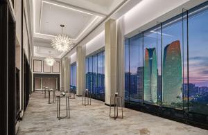 a lobby with a view of the skyscrapers at Waldorf Astoria Chengdu in Chengdu