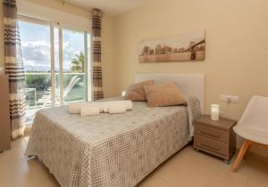 En eller flere senge i et værelse på AT Zalamera Beach