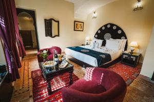 Postel nebo postele na pokoji v ubytování Les Borjs De La Kasbah