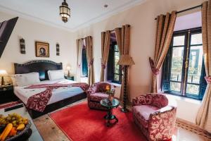 Postel nebo postele na pokoji v ubytování Les Borjs De La Kasbah