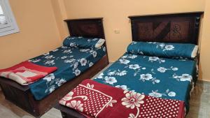 Postel nebo postele na pokoji v ubytování Siwa Shali Hostel