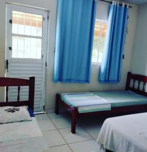 Ένα ή περισσότερα κρεβάτια σε δωμάτιο στο Pousada São Martins