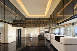 Lobi atau kawasan kaunter penerimaan di Atour Hotel Guangzhou Nansha UNI MALL