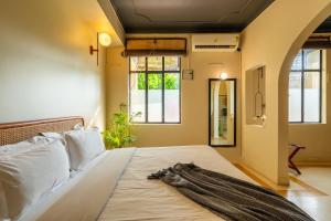 Voodi või voodid majutusasutuse Minimalist One Hauz Khas Village toas
