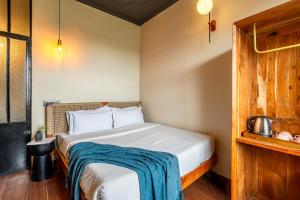 Voodi või voodid majutusasutuse Minimalist One Hauz Khas Village toas