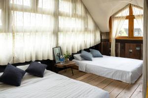 Postel nebo postele na pokoji v ubytování De Yang House Sa Pa