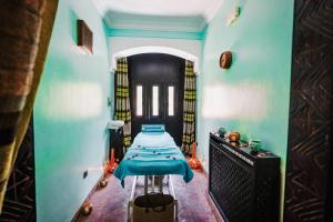 Postel nebo postele na pokoji v ubytování Les Borjs De La Kasbah