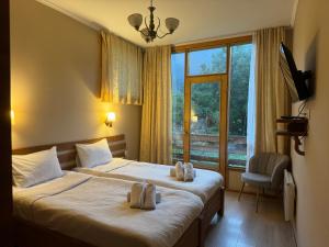 Postel nebo postele na pokoji v ubytování Hotel Old Seti
