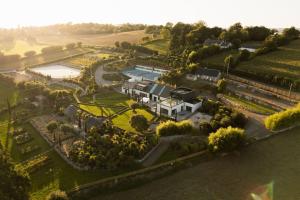 an aerial view of a house with a pool at Villa, piscine intérieure - Baie Mont Saint Michel in Le Petit-Celland
