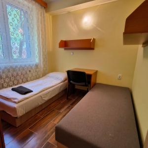 A bed or beds in a room at Rekreačné zariadenie Javorinka