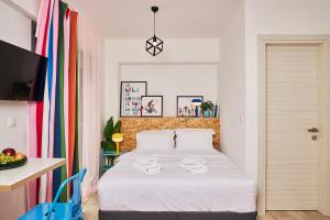 Ένα ή περισσότερα κρεβάτια σε δωμάτιο στο Superstudio Pop Art Apartments by BiNoBi!