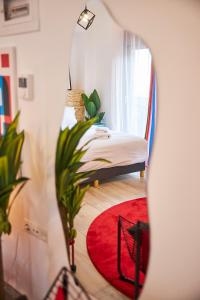 Ένα ή περισσότερα κρεβάτια σε δωμάτιο στο Superstudio Pop Art Apartments by BiNoBi!