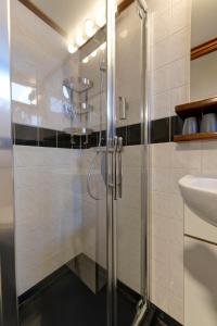 a bathroom with a shower and a sink at La Mar in Amsterdam +28 photos