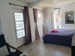 Postel nebo postele na pokoji v ubytování Studio avec jardin-Proche LDLC-Groupama Stadium-Eurexpo-métro