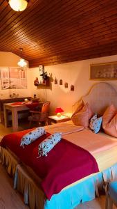 a bedroom with a large bed with pillows on it at Appartement Christina in Bad Kleinkirchheim