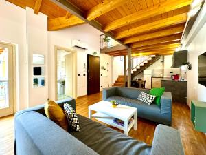 a living room with a couch and a table at Little Loft in Timişoara
