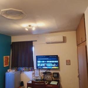 a room with a flat screen tv on the wall at Villa Cacao in Abidjan