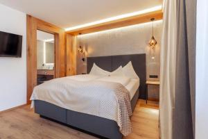 Ένα ή περισσότερα κρεβάτια σε δωμάτιο στο Hotel Mondin