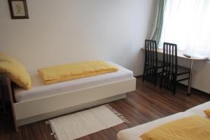 Postel nebo postele na pokoji v ubytování Pension Casa Topolino