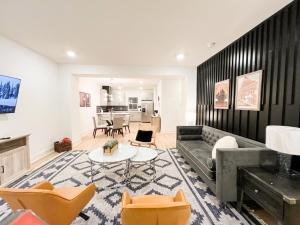 a living room with a couch and a table at Hermitage House Near Opryland & Airport Game Room in Nashville