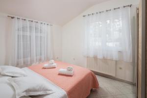 Postel nebo postele na pokoji v ubytování Villa Kristina