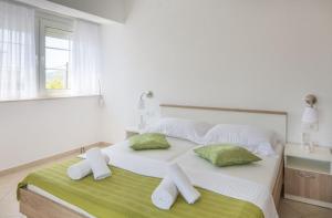 Postel nebo postele na pokoji v ubytování Villa Kristina