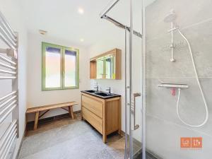 a bathroom with a shower and a sink at La marinière in Audinghen +16 photos