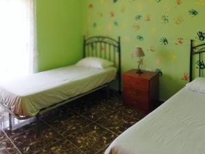 Postel nebo postele na pokoji v ubytování Live la Victoria Carril - Casa acogedora y familiar con terraza completa