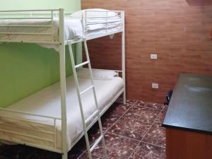 two bunk beds in a room with a counter at Live la Victoria Carril in La Victoria de Acentejo