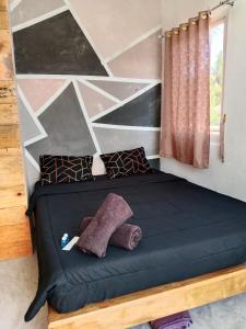 Postel nebo postele na pokoji v ubytování Anggie Homestay